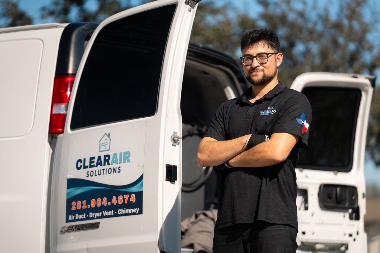 ClearAir Solutions technician by branded service van